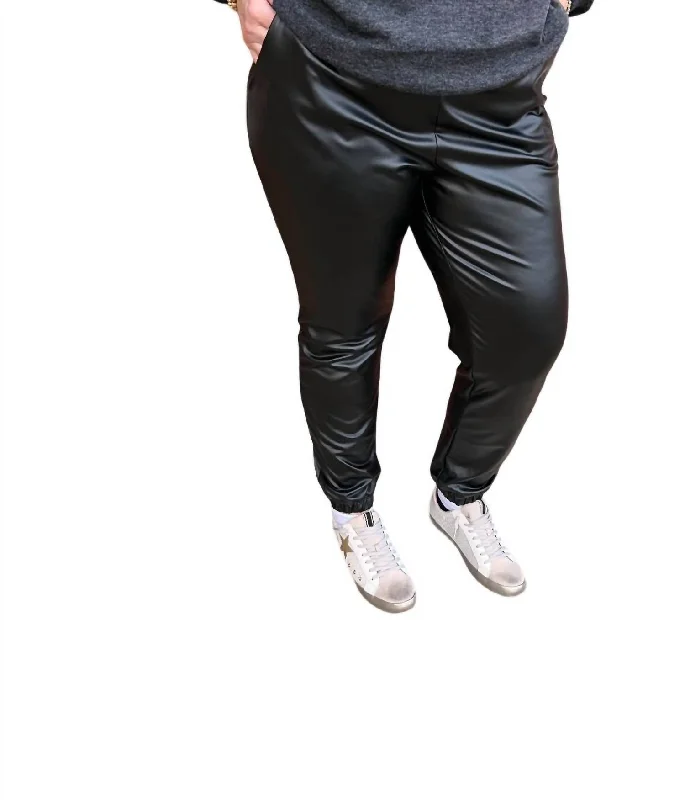 Vintage-inspired tight trousers for women with buttoned waist and retro charm -Solid Faux Leather Joggers In Black